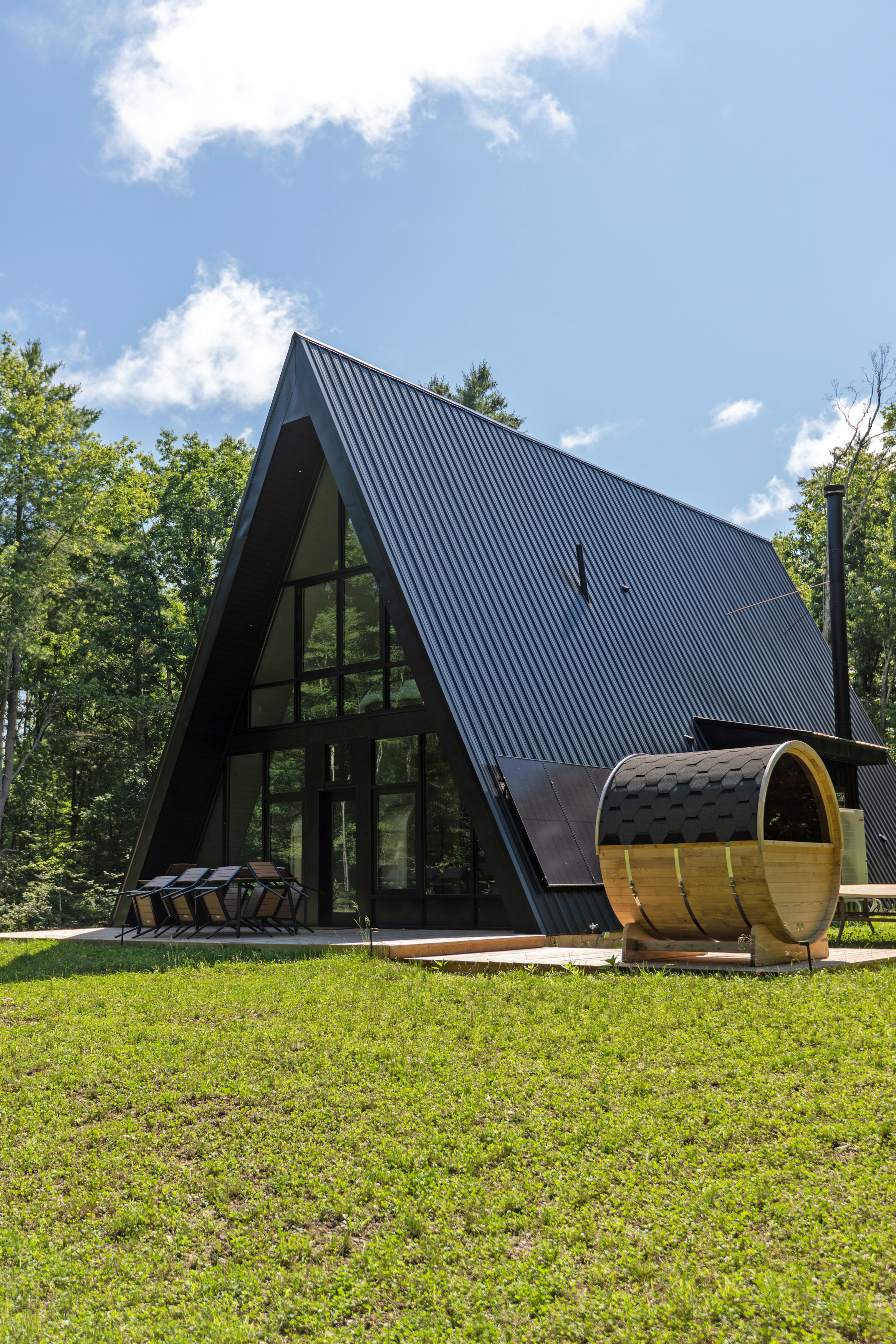 Cedar barrel sauna and back deck at a Catskills A-frame